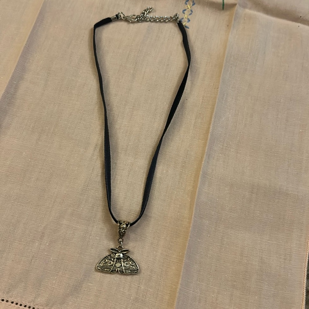 Black ribbon moth pendant necklace